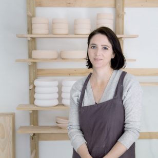 Throwing pottery on wheel.